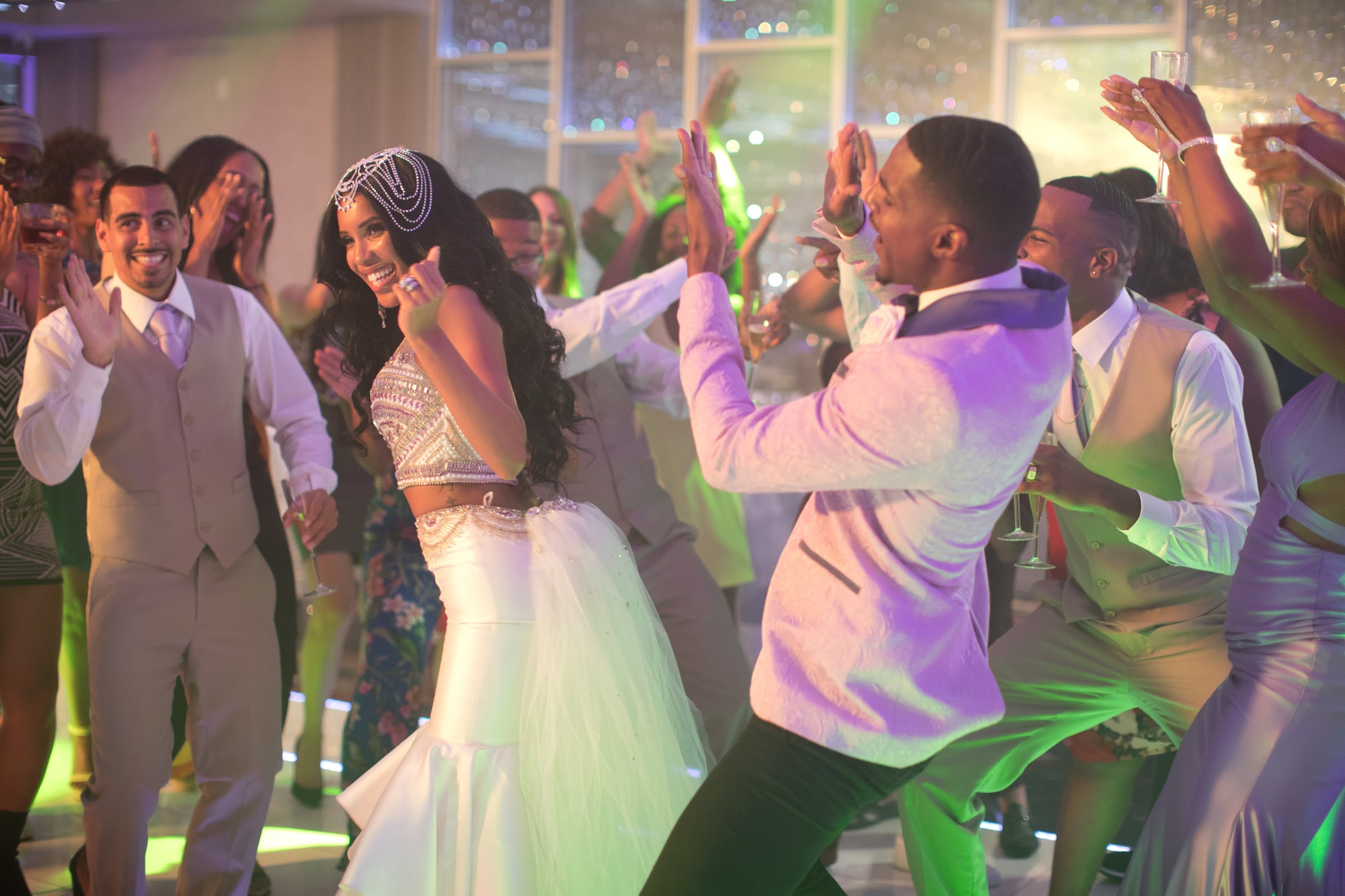 Wedding dance floor under green and purple light, one of five distinct wedding designs in Always a Bridesmaid