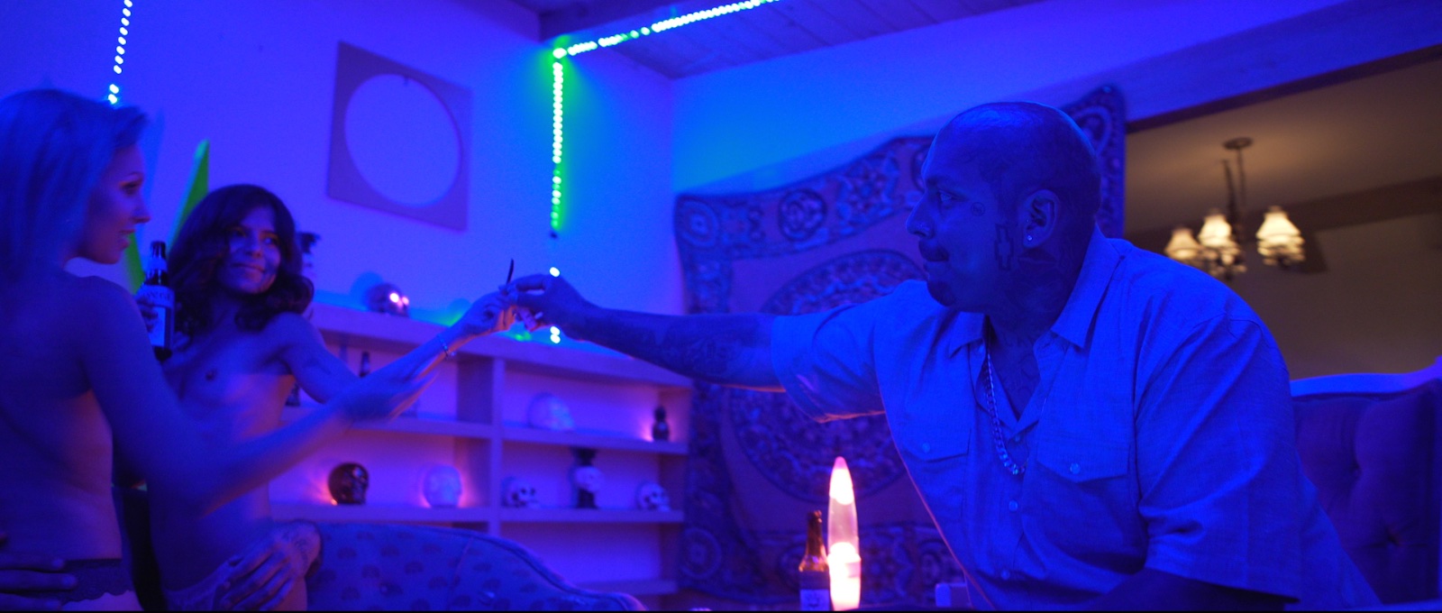 Bedroom interior lit in neon blue in Avenge the Crows