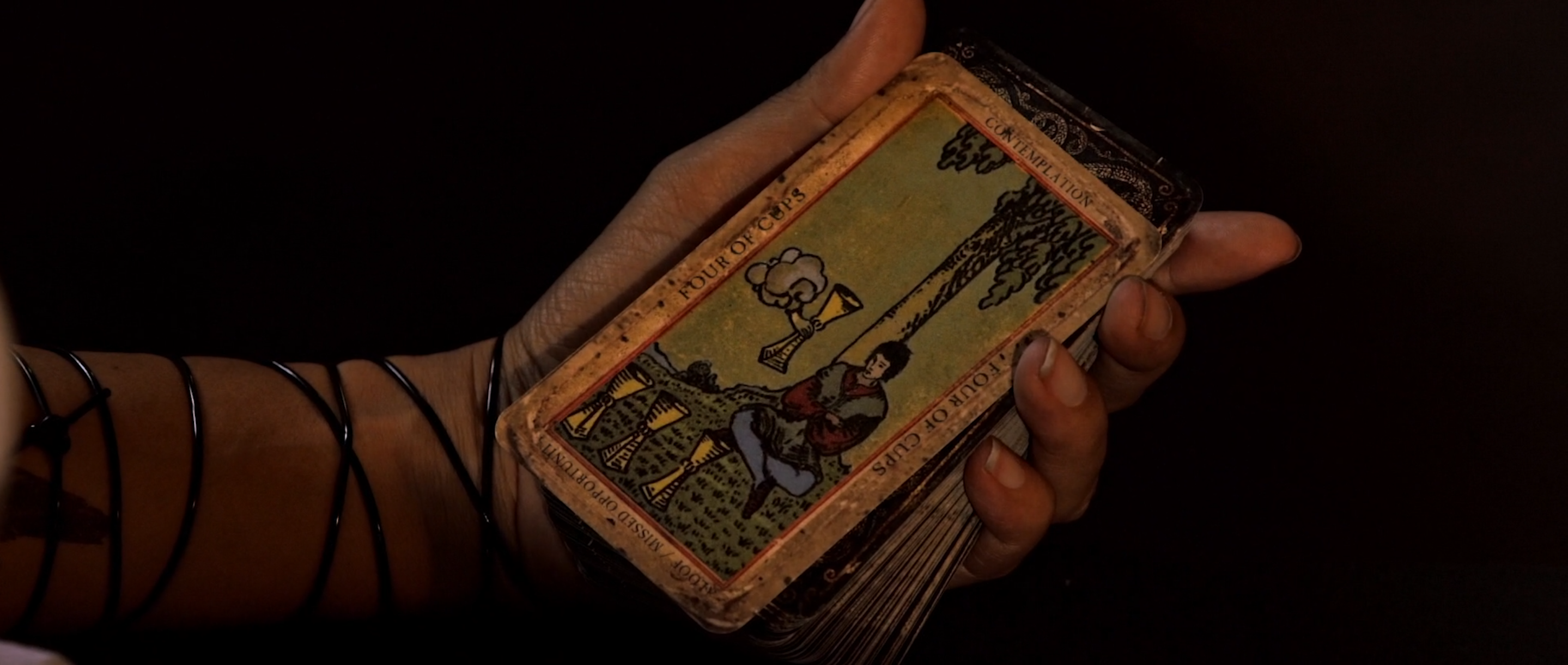 Hand holding a Mexican loteria-style card, a prop built in house for Avenge the Crows