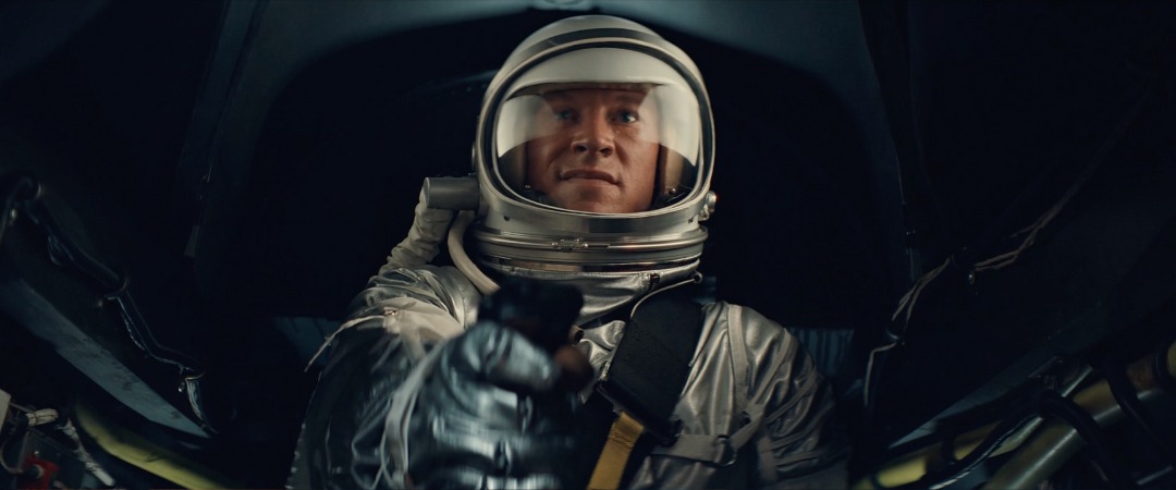 Pilot in a silver pressure suit and bubble helmet inside the built X-15 cockpit, Edge of Space
