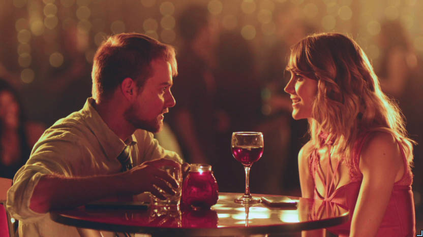 Candlelit dinner for two with red wine in warm bokeh light, In Other Words