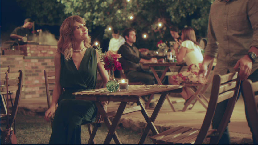 Outdoor evening dinner under string lights at the vineyard estate built for In Other Words