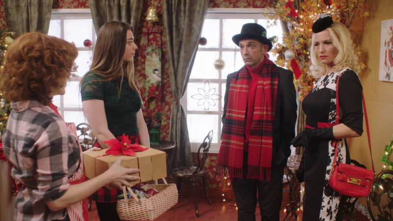 Three characters in the decorated bakery interior built for This Is Our Christmas