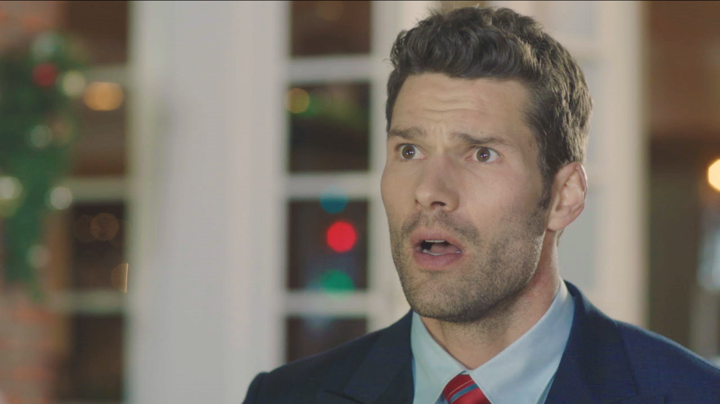Close portrait of a man in a suit and red tie, This Is Our Christmas